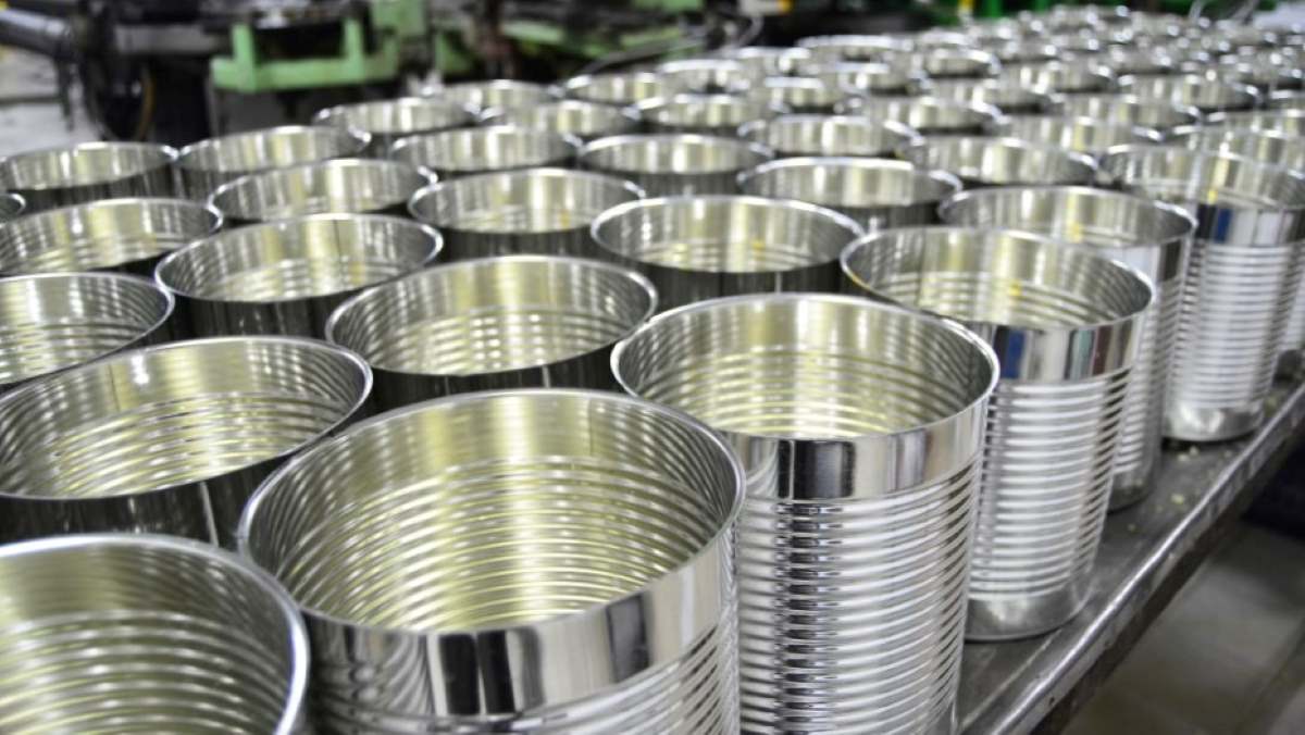Metal cans on production line ready to be filled