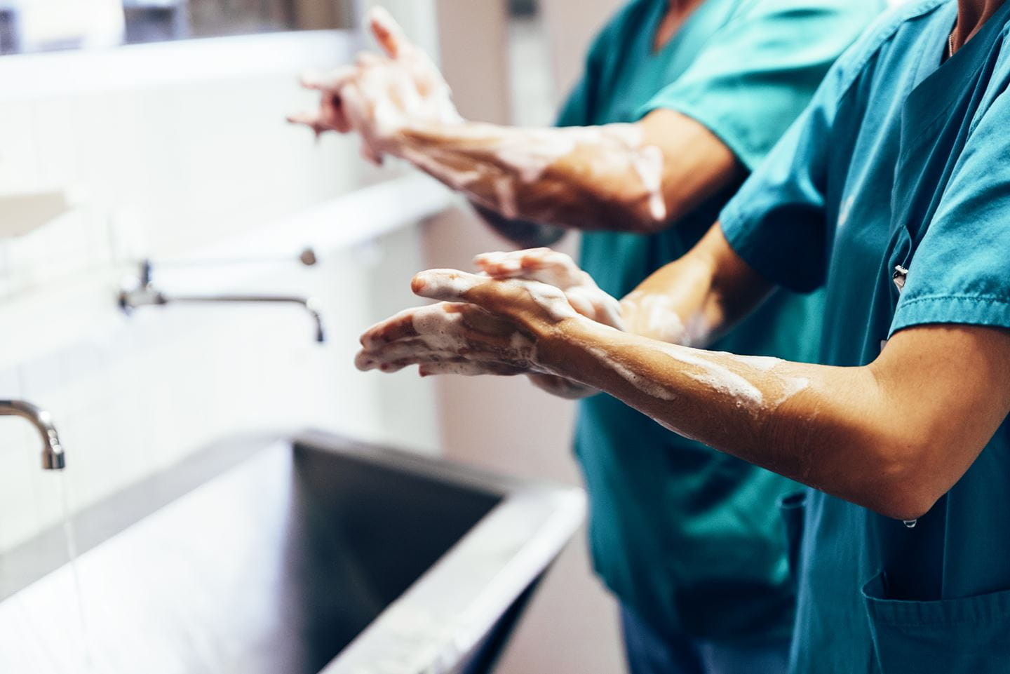 Two surgeons washing hands