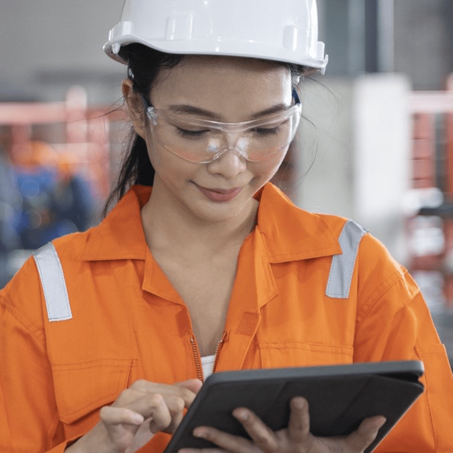 Engineer with hat and orange vis jacket