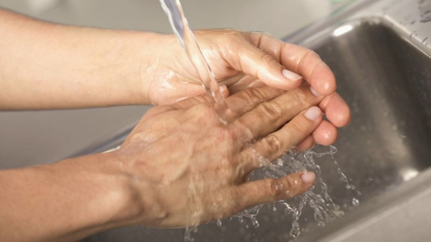 Doctor washing hands before surgery