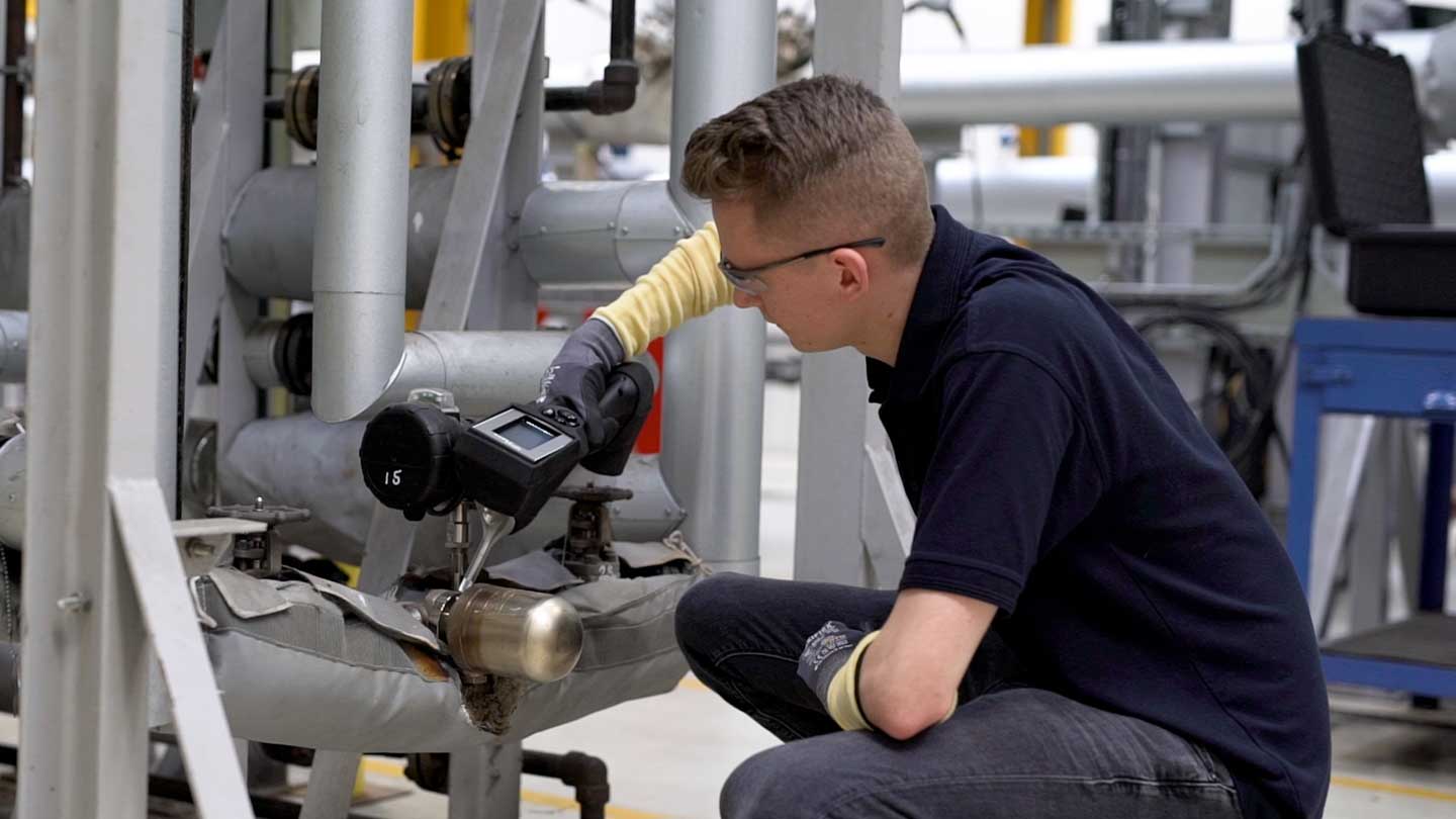 Engineer testing steam trap with STAP Handheld device