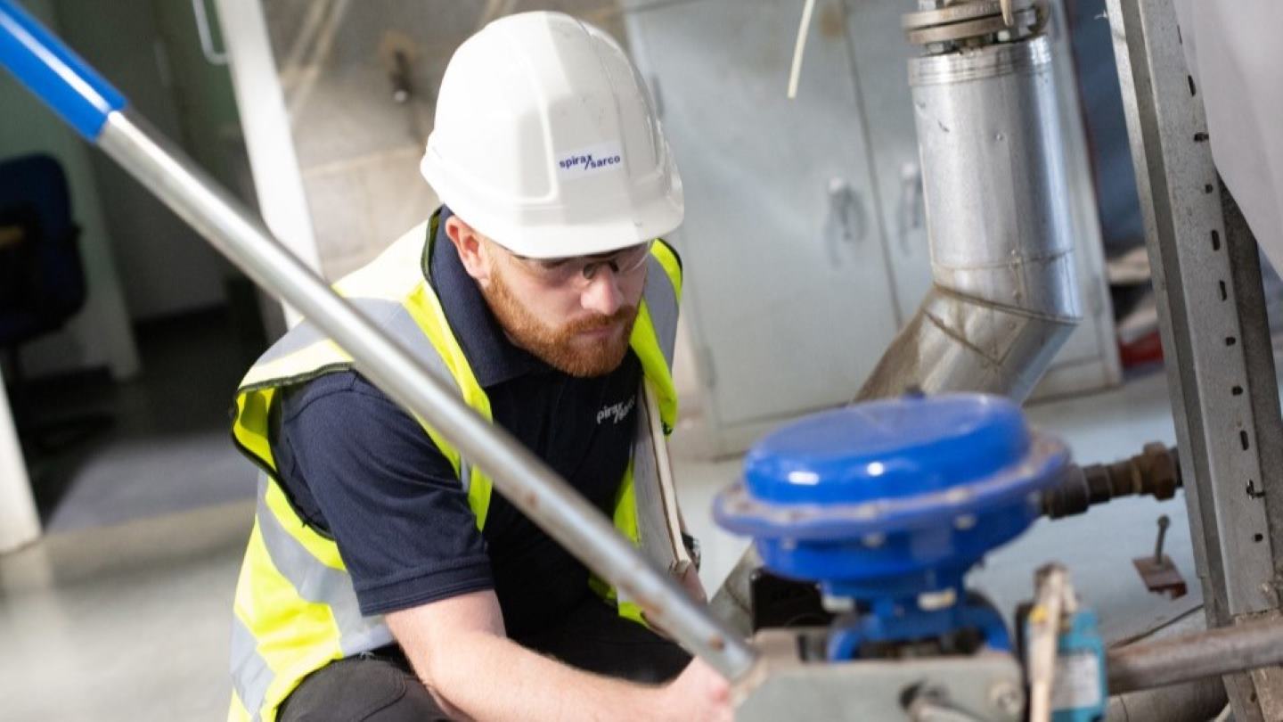 Spirax Sarco engineer inspecting machinery