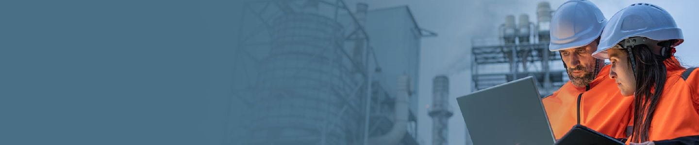 Engineers reviewing reports at energy plant
