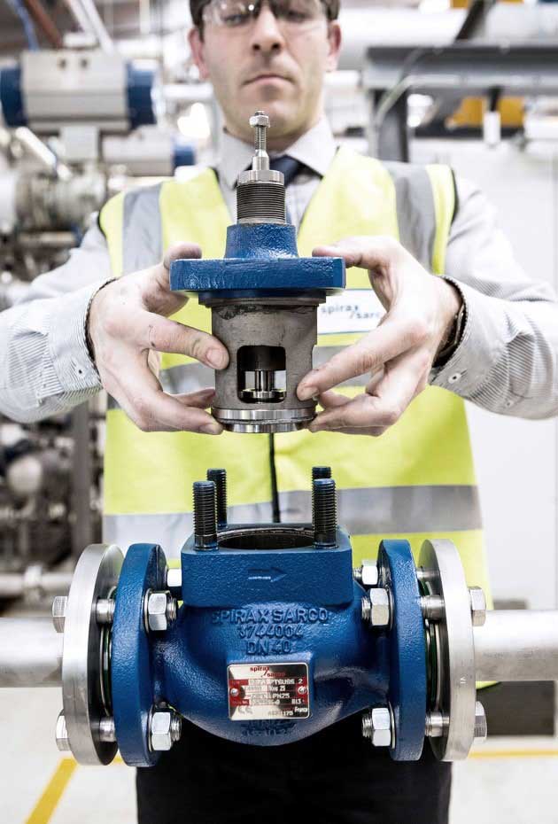 Spirax Sarco engineer is building a product by hand