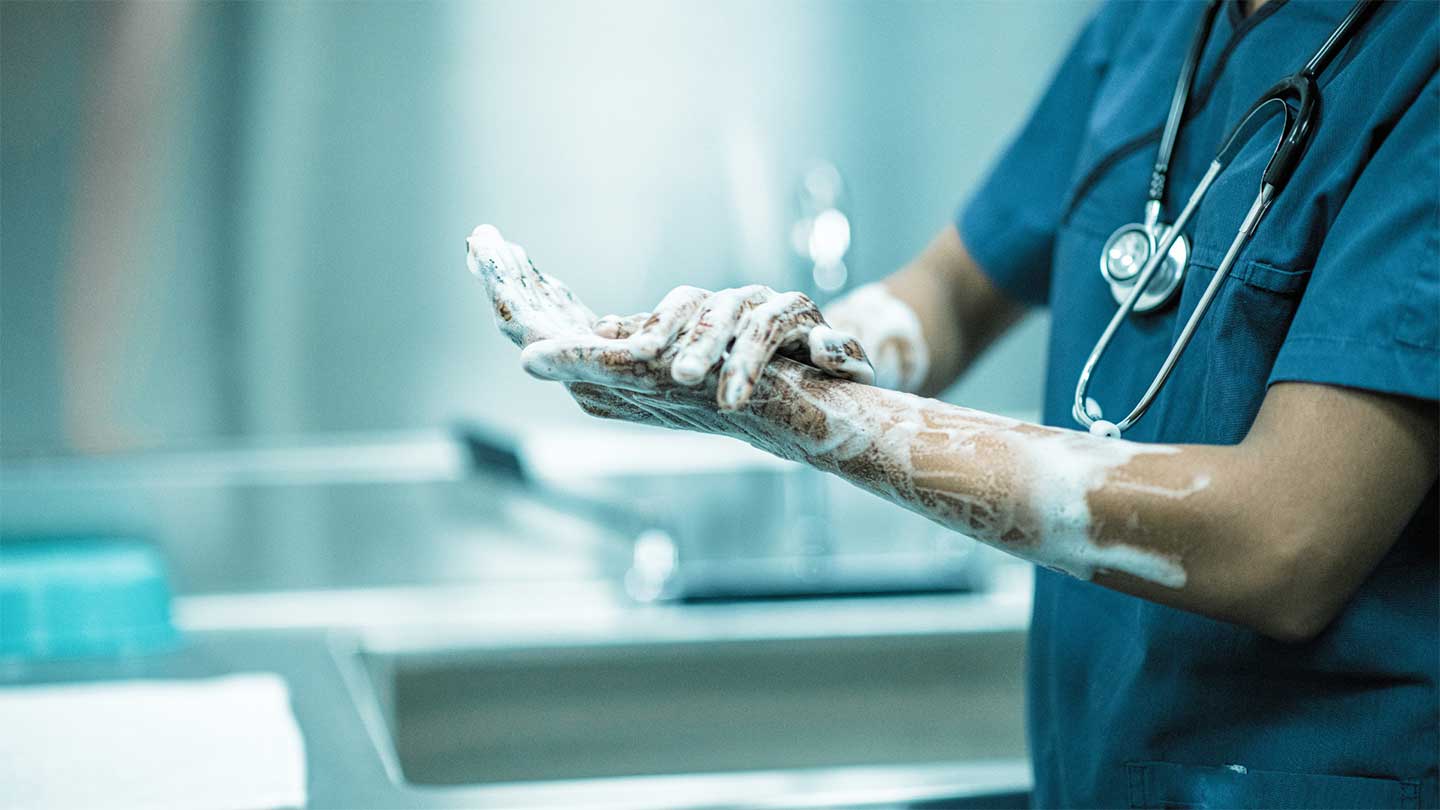 Surgeon washing hands
